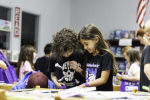 Students picking out books at BookFest