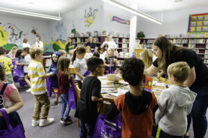 Students selecting books at BookFest 2023