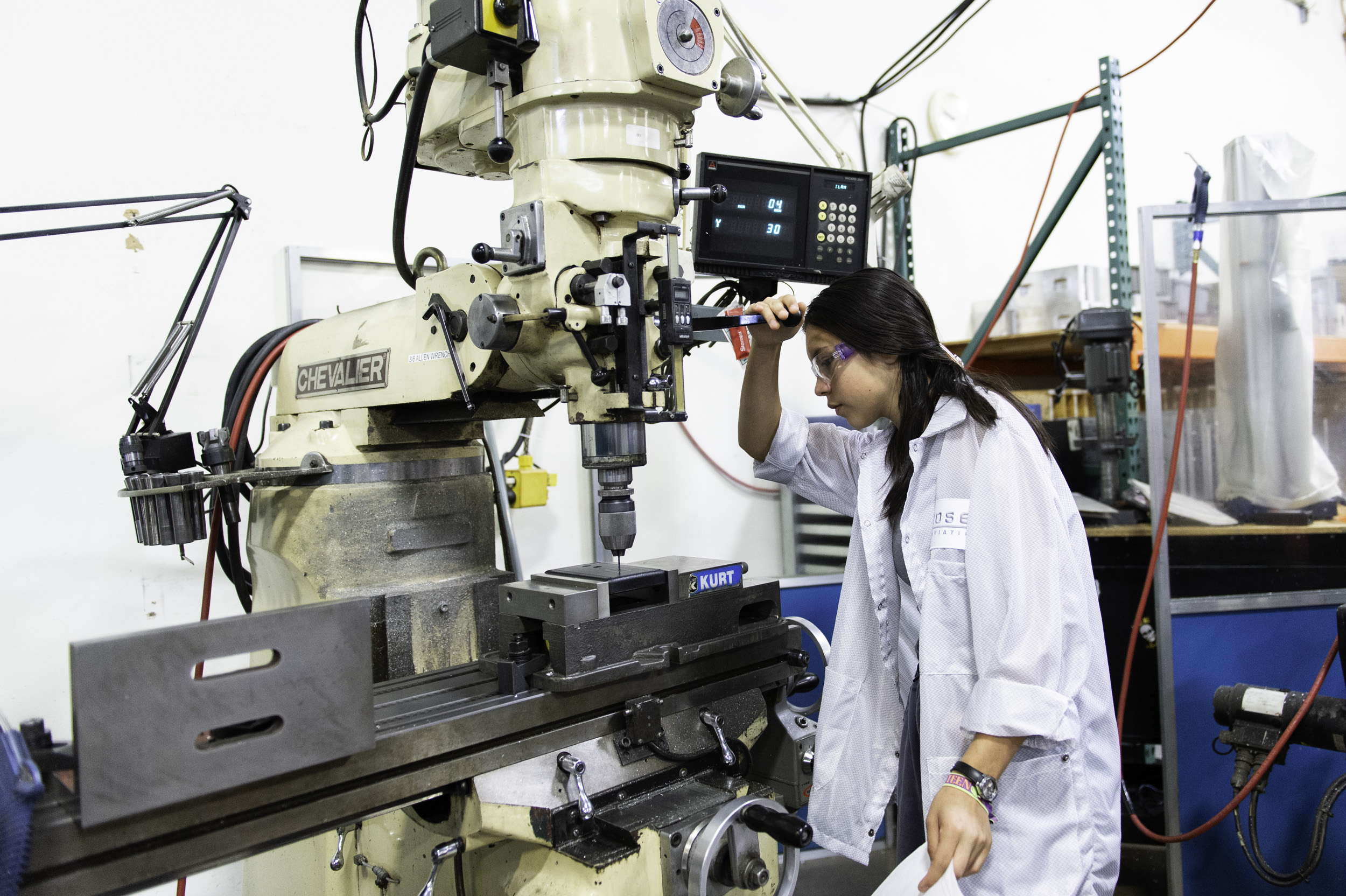 Izel running a machine at Rosen Aviation