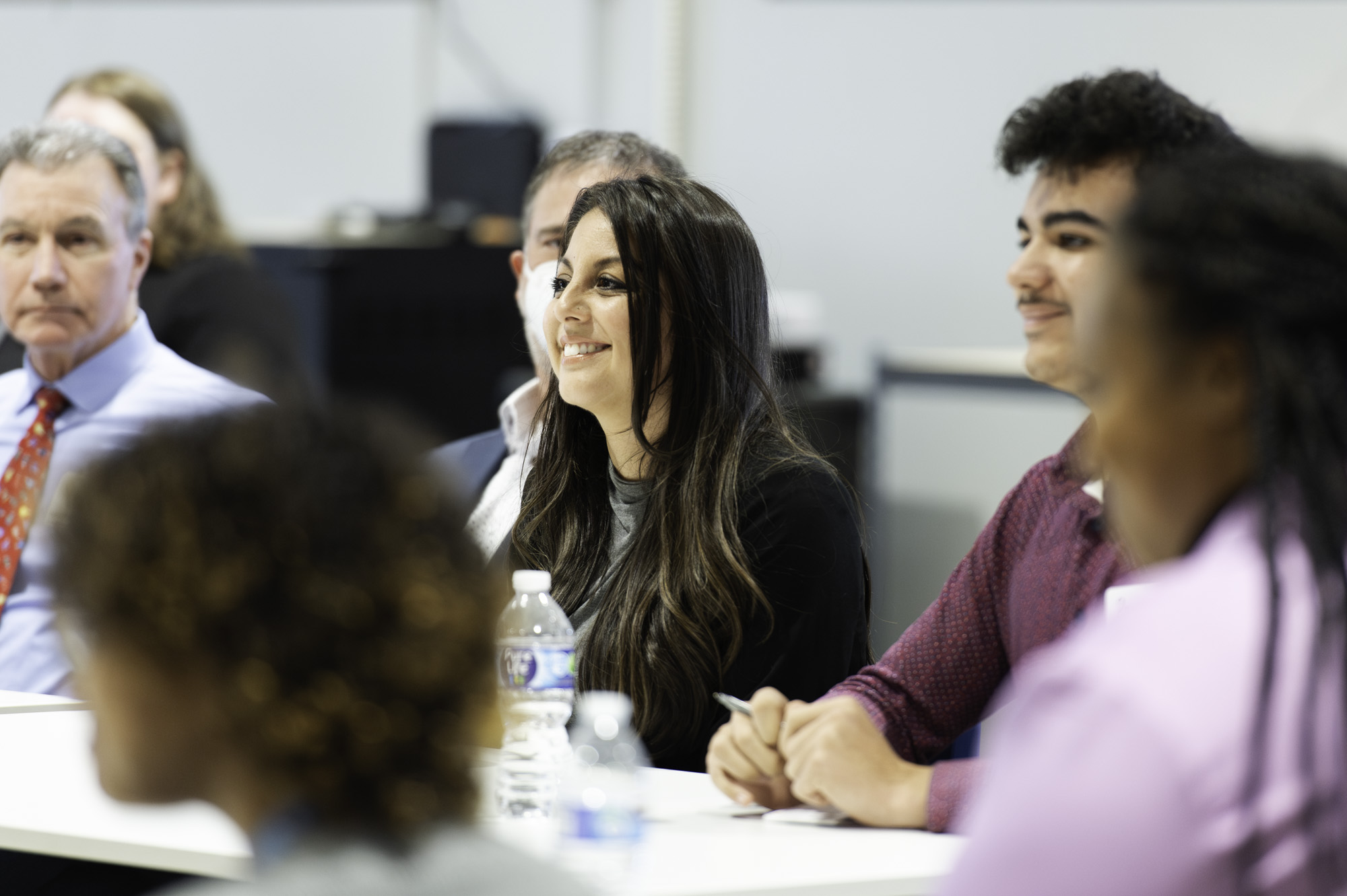 2023_Governor-Visit-15 Monica smiling during a small group discussion.