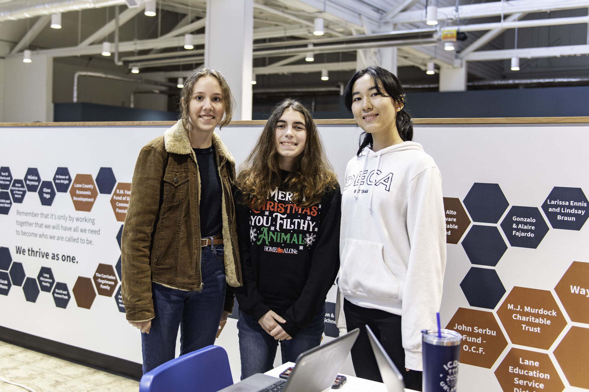 A codeORcreate team smiling at the camera.