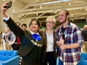 Mars taking a selfie with Governor Tina Kotek and Julio.