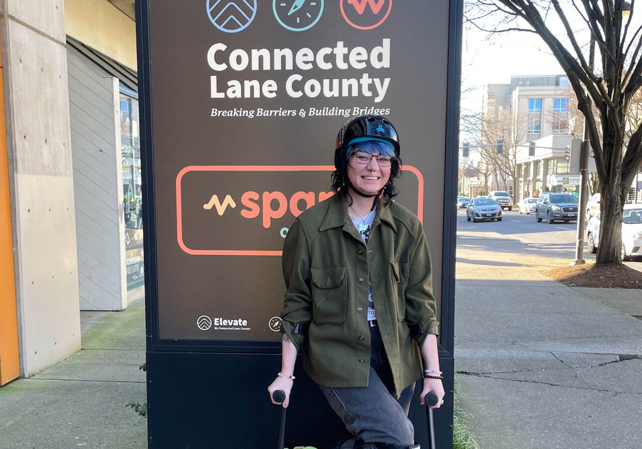 Elliott in front of Connected Lane County Signage.