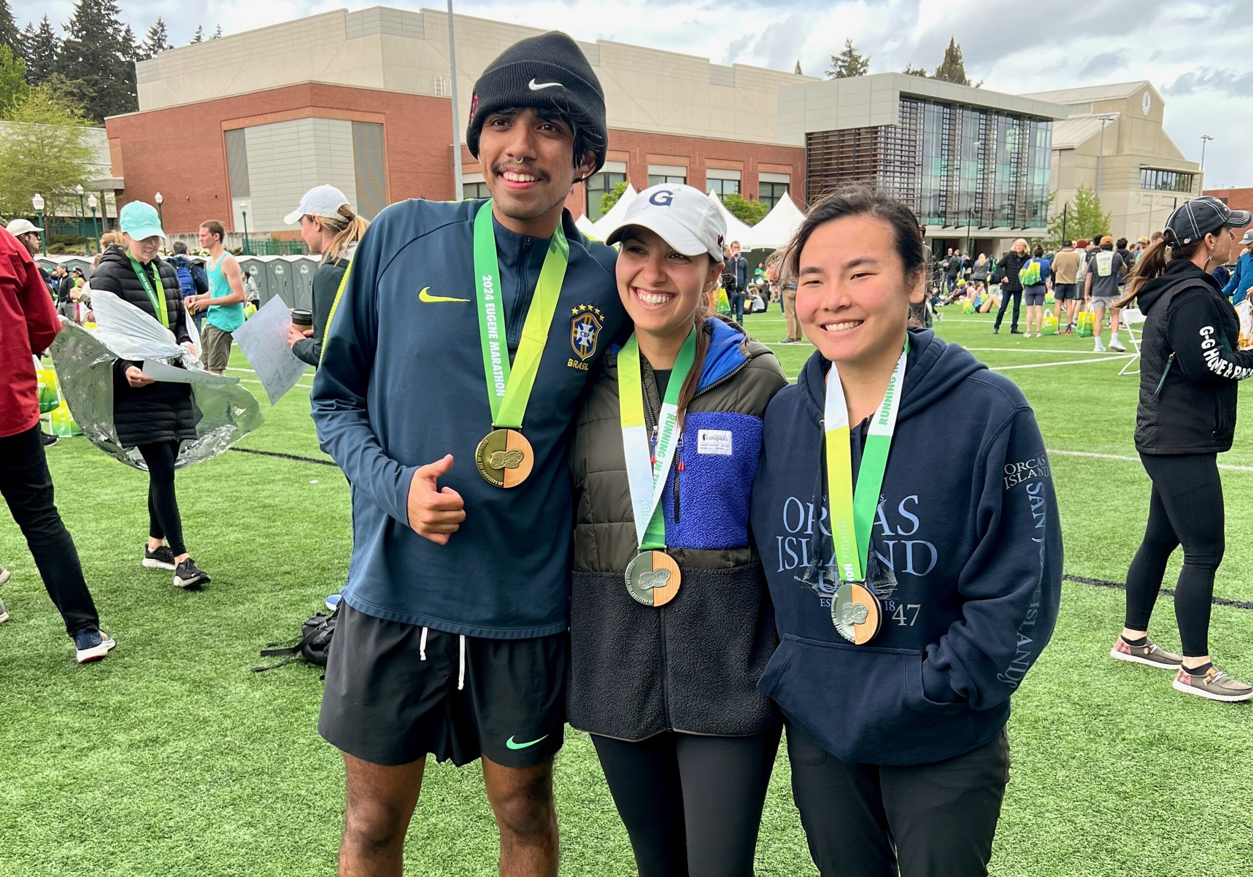 Left to right: Jerry, Iliana, and Jade posing for a photo at the Eugene Marathon