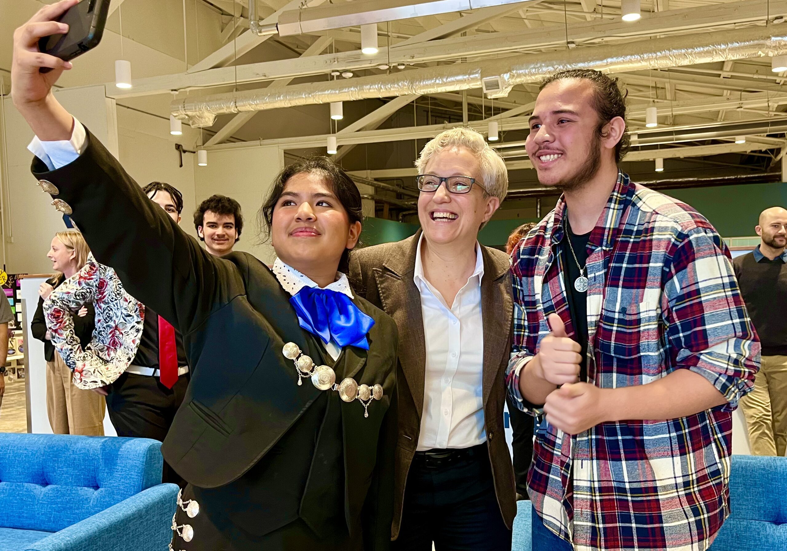 Mars taking a selfie with Governor Tina Kotek and Julio.