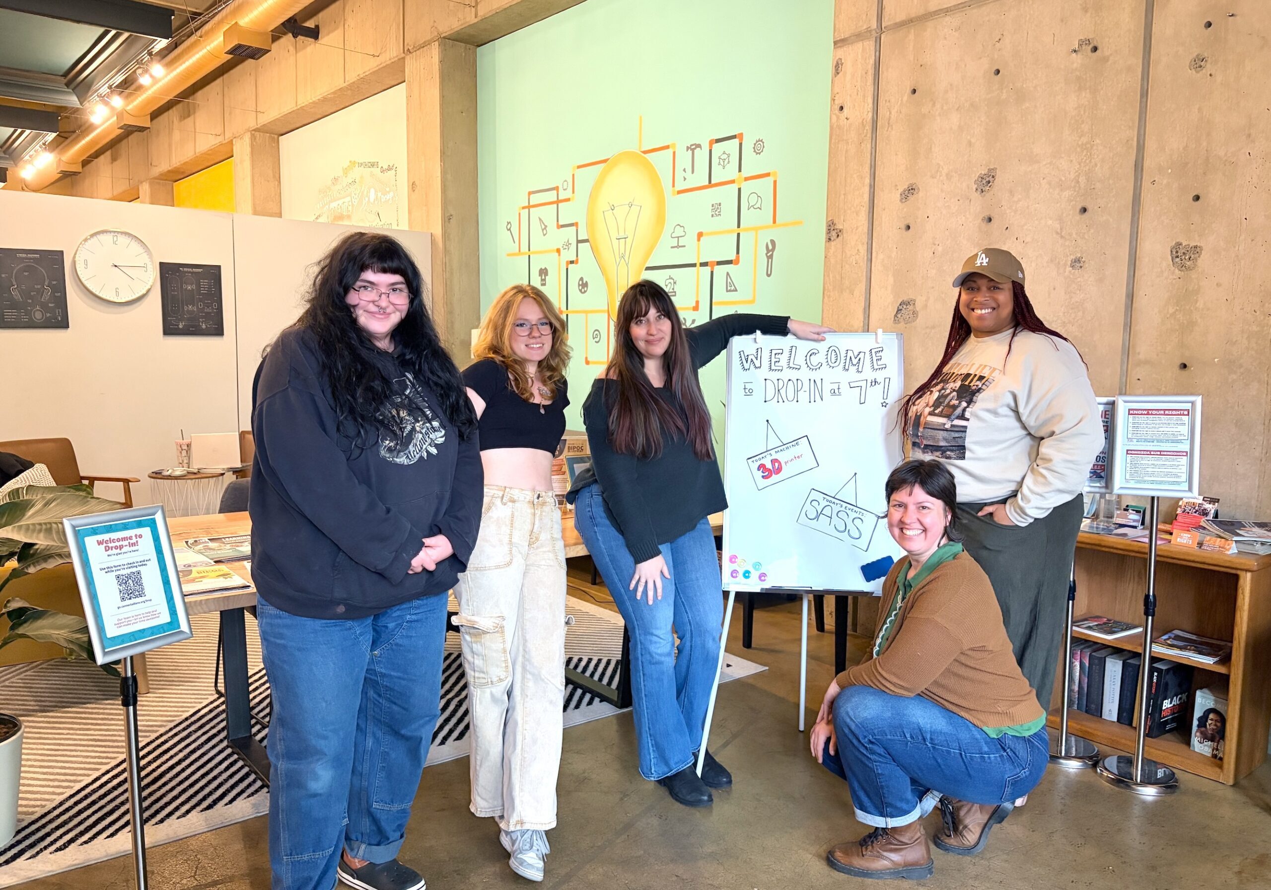 Drop-In Staff standing at the front of Spark on 7th